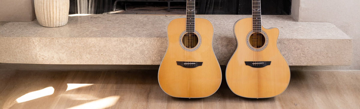 Berkeley guitar, Sierra guitar, and Cleo guitar sitting against a media console