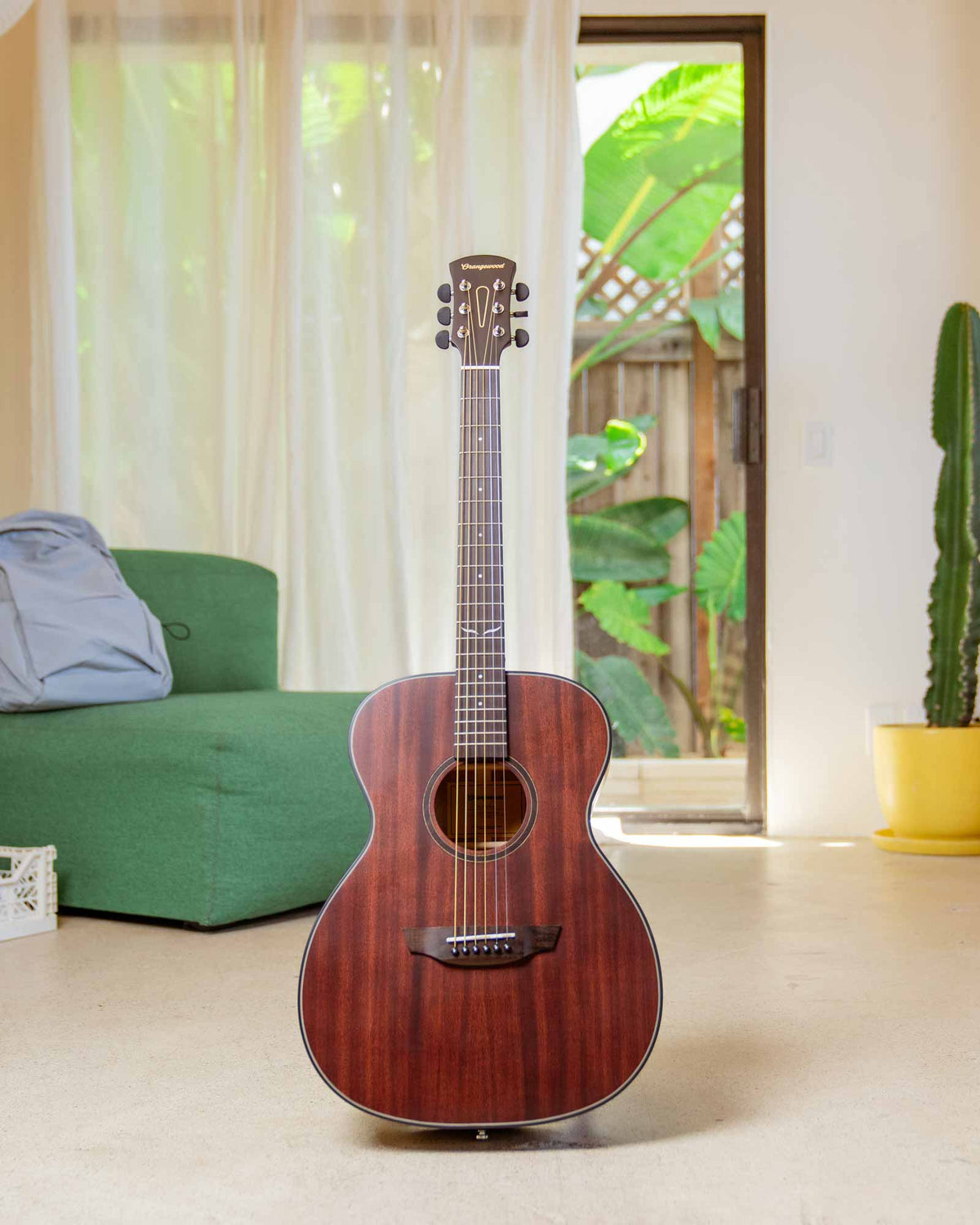 Oliver mahogany guitar in a living room