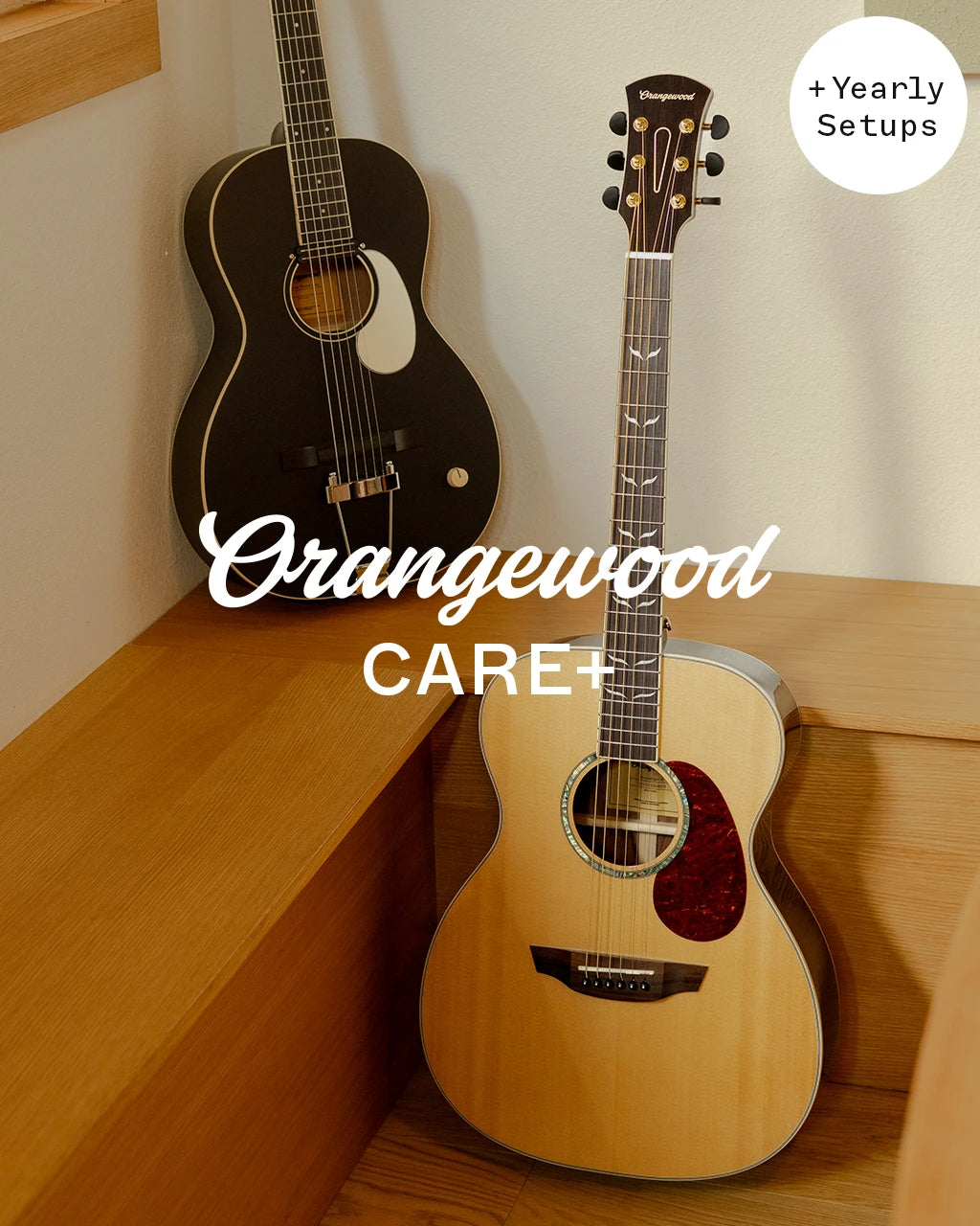 Orangewood Care+ with yearly setups: black rubber bridge guitar and natural acoustic guitar in a corner