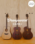 Orangewood Care+ with yearly setups: three acoustic guitars against a plywood wall
